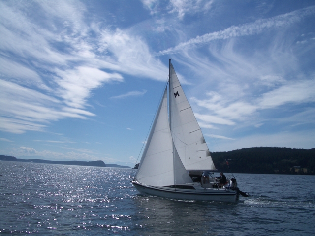 The helmsman is not at risk from the boom as
seen in this photo. In addition, a large Genoa
can be accomodeated on roller furling mechanisms
making the main sail the more difficult sail 
to reef. 