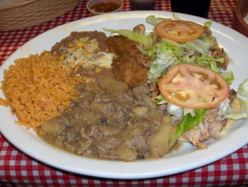 Chile verde, rice, beans, chile relleno, and two chicken tostadas are one of the many combination plates