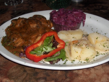 Chicken Schnitzel with potato 
salad and red cabbage