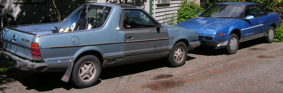 Photo of 2 subarus in my driveway