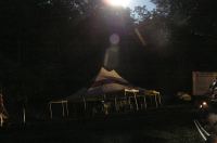 wrestlers' tents illuminated 
solely by full moon