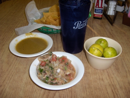 Ceviche, green salsa, chips, and lemonade