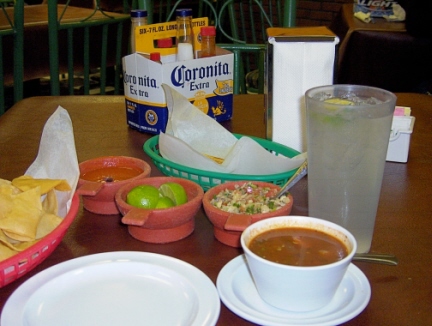 Ceviche, soup, chips, garlic bread, and lemonade